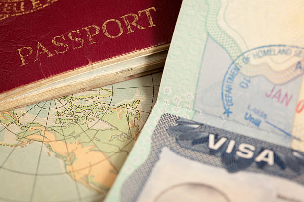 A passport, a world map and a U.S. visa page