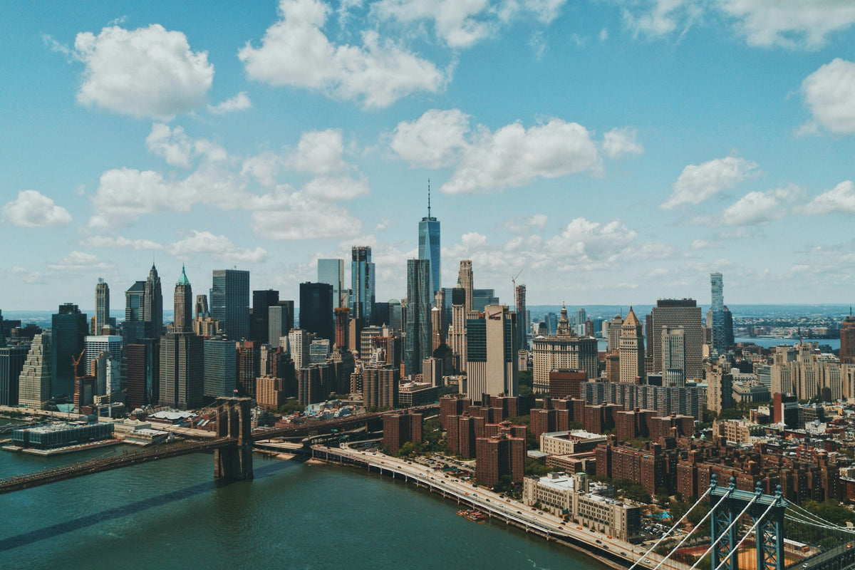 Aerial view of the Manhattan skyline and Brooklyn Bridge over the East River