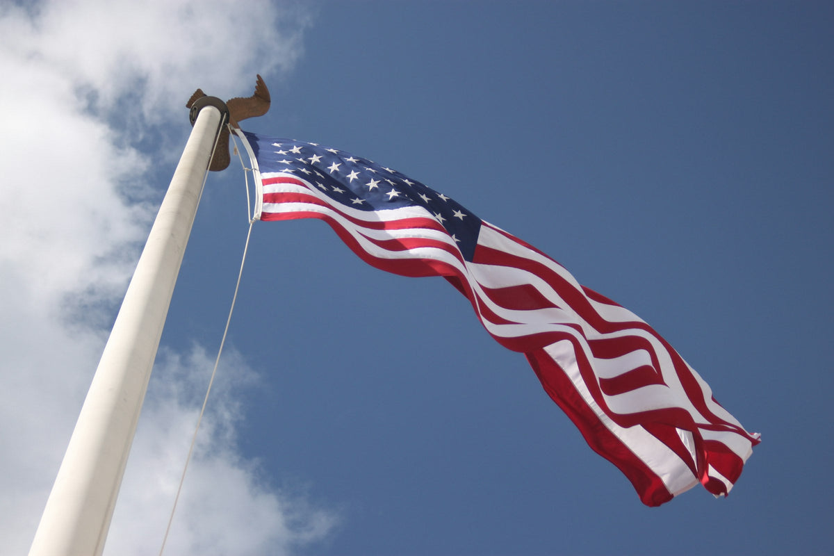 American flag flying against a blue sky